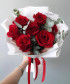 7 красных роз Эксплорер с эвкалиптом в букете 